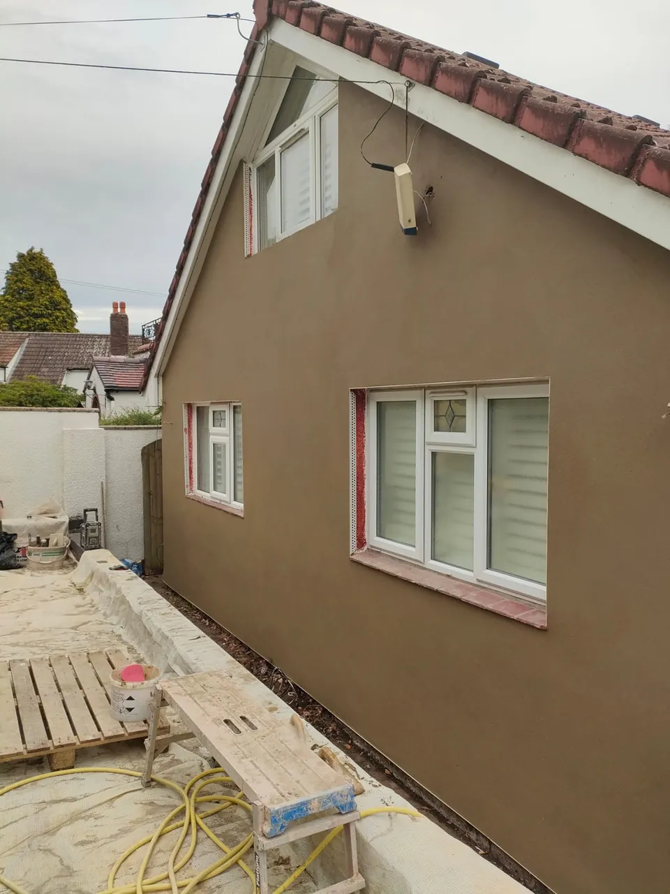 The same gable end with the smooth finished render completed