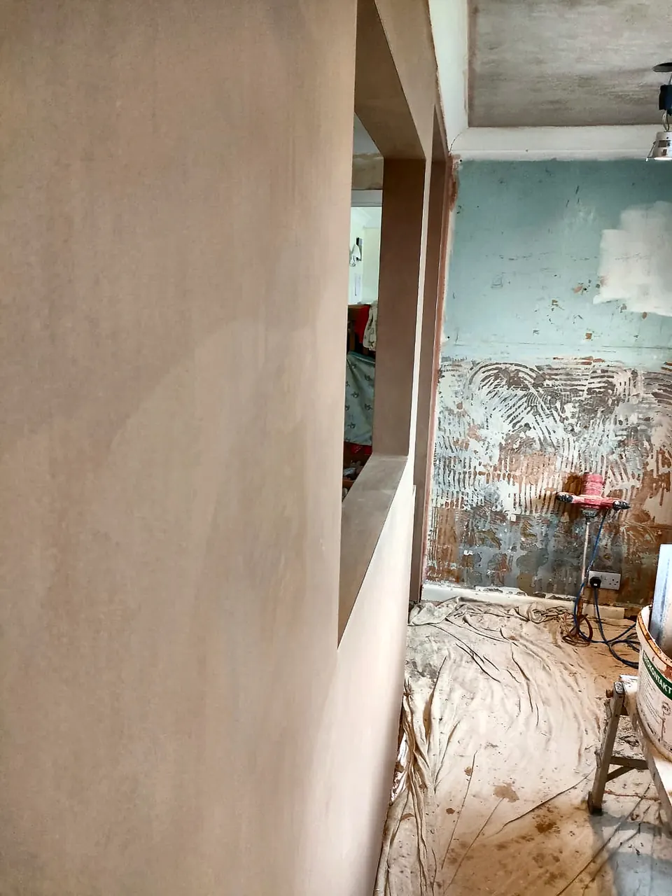 Smooth skimmed interior wall during a house renovation