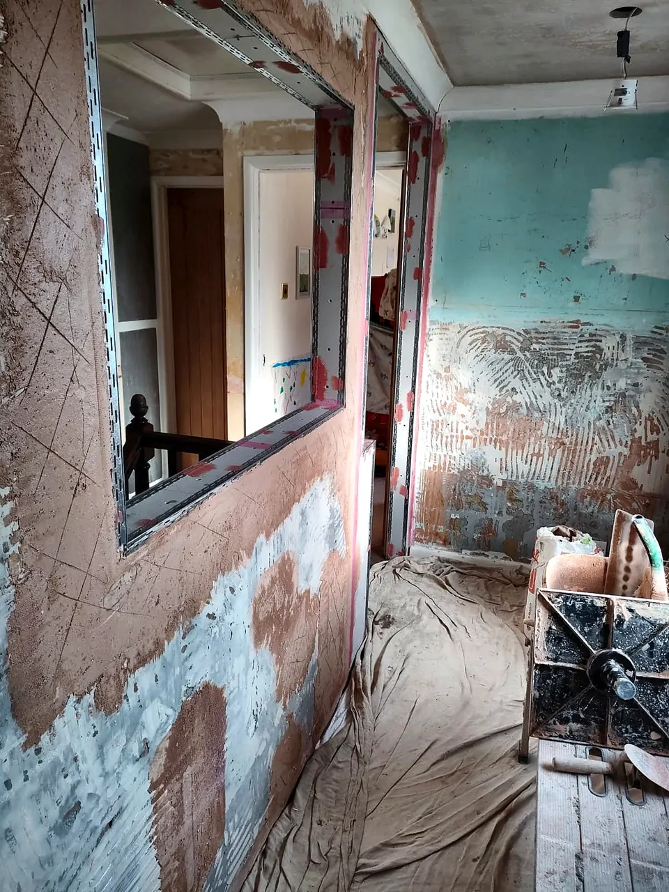 Interior wall prepared with hacked-off surface during renovation